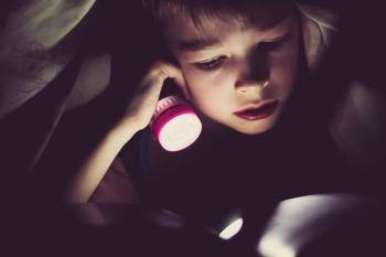 Is Reading in the Dark With a Flashlight Bad for Your Eyes?